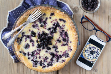 Blueberry pie and smartphone