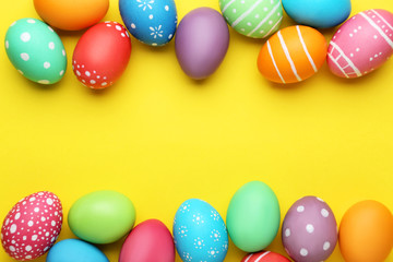 Wall Mural - Colorful easter eggs on yellow background