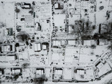 Fototapeta Młodzieżowe - Aerial view of allotment covered in snow with tiny houses