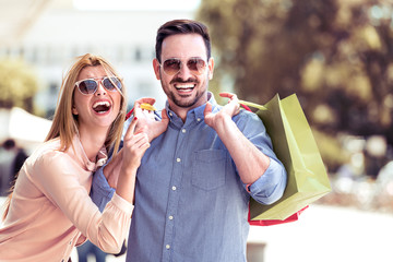 Wall Mural - Happy couple in shopping.