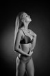 © zhagunov_a - young sexy girl in underwear on a black background