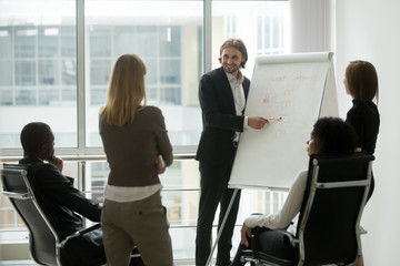 Sticker - Smiling business coach teaching sales marketing team on staff training giving presentation using flip chart, team leader explaining employee new strategy on corporate seminar education teamwork