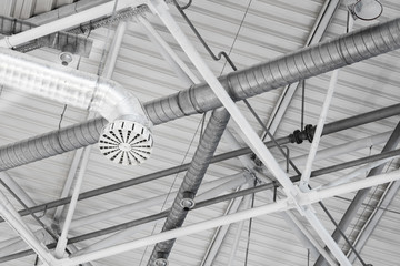 Leinwandbilder - a system of ventilation pipes under stadium ceiling