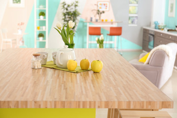 Canvas Print - Wooden table with cups and teapot on kitchen