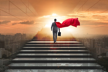 Businessman superhero successful in career ladder concept