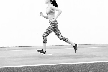 Wall Mural - White woman running on track