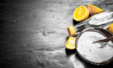 Fototapeta  - Baking soda in a bowl with vinegar and lemon slices.