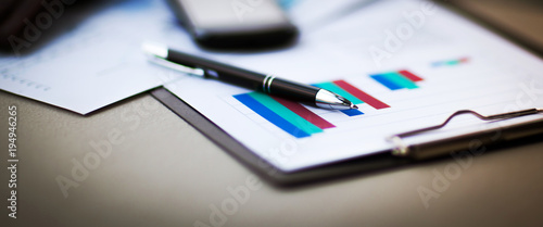 Fotomural financial charts and graphs on the table