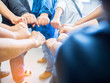 © meeboonstudio - Closeup image of many people putting their fists together as symbol of unity. Teamwork Concept.