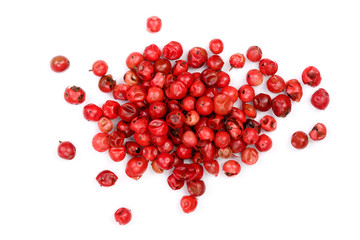 Wall Mural - pink peppercorns seeds isolated on white background. Top view. Flat lay