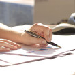 © yurolaitsalbert - Business Woman Writing with pen