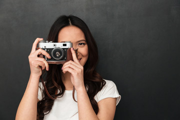 Wall Mural - Asian young happy woman photographer