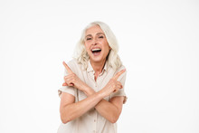 Portrait Of A Laughing Mature Woman Pointing Fingers