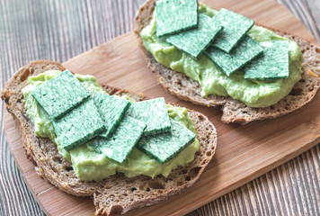 Sticker - Slices of toasted bread with avocado paste and basil cheese