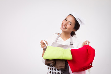 happy smiling asian woman carrying laundry basket; portrait of domestic helper, woman housekeeper, housewife, woman maid holds laundry basket; girl cloth cleaning laundry service staff studio portrait