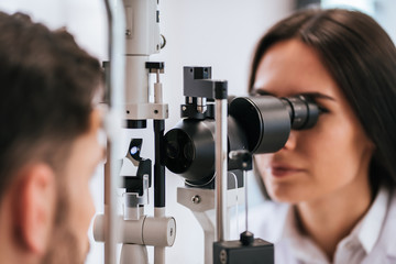 Wall Mural - Doctor and patient in ophthalmology clinic