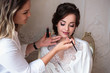 © cherry_d - makeup artist preparing beautiful bride before the wedding in a morning