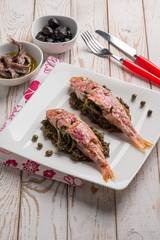 Sticker - red mullet with sauteed endive capers and black olives