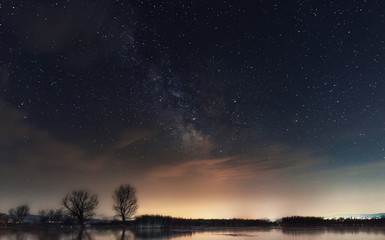 Wall Mural - Milky Way over the lake. Milky Way galaxy over the Dojran Lake, FYR Macedonia. The night sky is astronomically accurate.