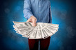 © ra2 studio - Businessman holding money