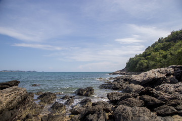 Wall Mural - Rocky shoreline and blue sky