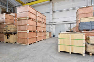 Large and light warehouse, cargo storage in wooden boxes