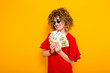 © Ivan Traimak - Attractive woman with short curly hair with cash