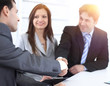© ASDF - handshake business partners in the workplace