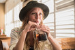 © Robinson Media Inc/Stocksy - close up of girl drinking a soda pop