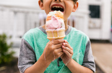 Treat: Young Boy Eats Messy Melting Ice Cream Cone