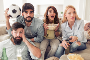 Sticker - Cheerful group of friends watching football game on tv