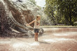 © Ina Peters/Stocksy - People: Girl having fun in splashing water