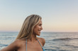 © victortorres/Stocksy - Portrait of a happy blonde girl at the beach