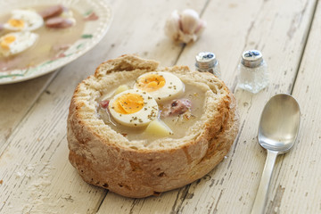 Wall Mural - Traditional polish soup called Zurek served in small bread