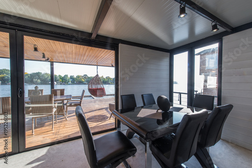 Luxury Dining Table With Leather Chairs In Log Cabin Near River