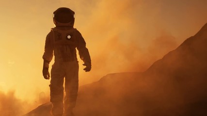 Wall Mural - proud astronaut confidently walks on mars surface. red planet covered in gas and rock, overcoming di