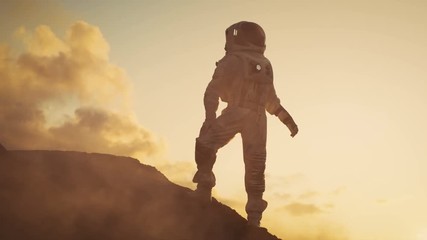 Wall Mural - Silhouette of the Astronaut Standing on the Rocky Mountain of the Alien Red Planet/ Mars. First Manned Mission on Mars. Space Exploration, Colonization. Shot on RED EPIC-W 8K Helium Cinema Camera.