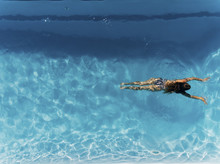 Aerial Shoot Of Woman In Swimming Pool.
