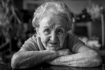 Wall Mural - Black and white portrait of an elderly woman, close-up.