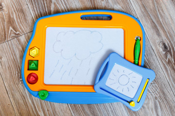 magnetic drawing boards big and small with a cloud and a sun