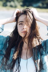 Wall Mural - Woman touch long healthy hair on sunny day outdoor