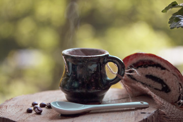 mug of hot morning coffee on the street