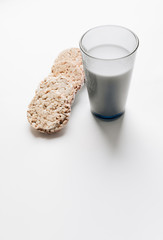 Crisp bread and glass of milk isolated over white background, healthy breakfast