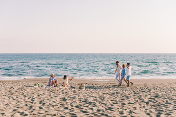 Wall Mural - Friends Gathering on the Beach