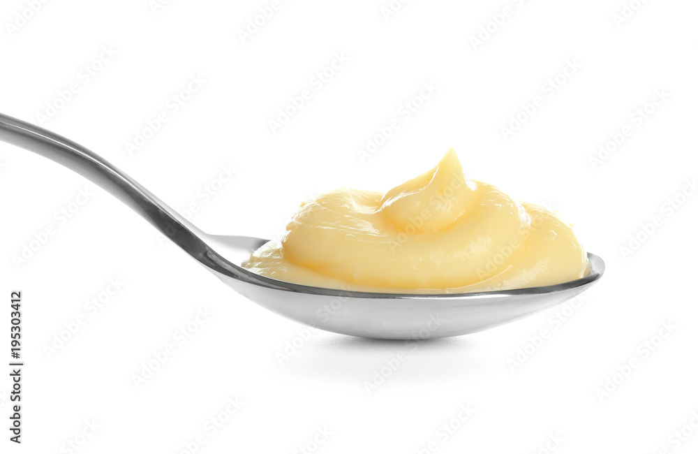 Obraz na płótnie Tasty vanilla pudding in spoon on white background w salonie