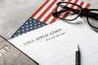 Passport, American flag and visa application form on table. Immigration to USA