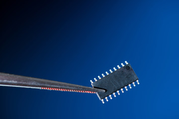 Poster - Electronic chip isolated on dark blue