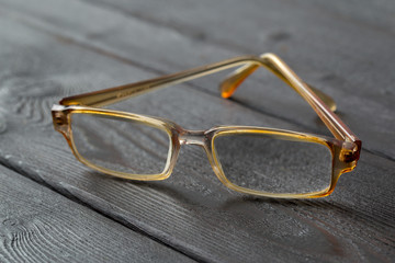 Wall Mural - eyeglasses on wooden table