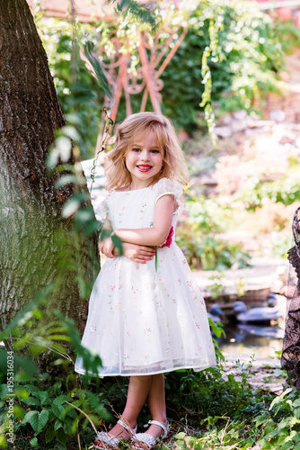 Small Girl Kid With Long Blonde Hair And Pretty Smiling Happy Face