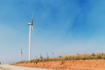 Wall Mural - concept idea eco power energy. wind turbine on hill at thailand